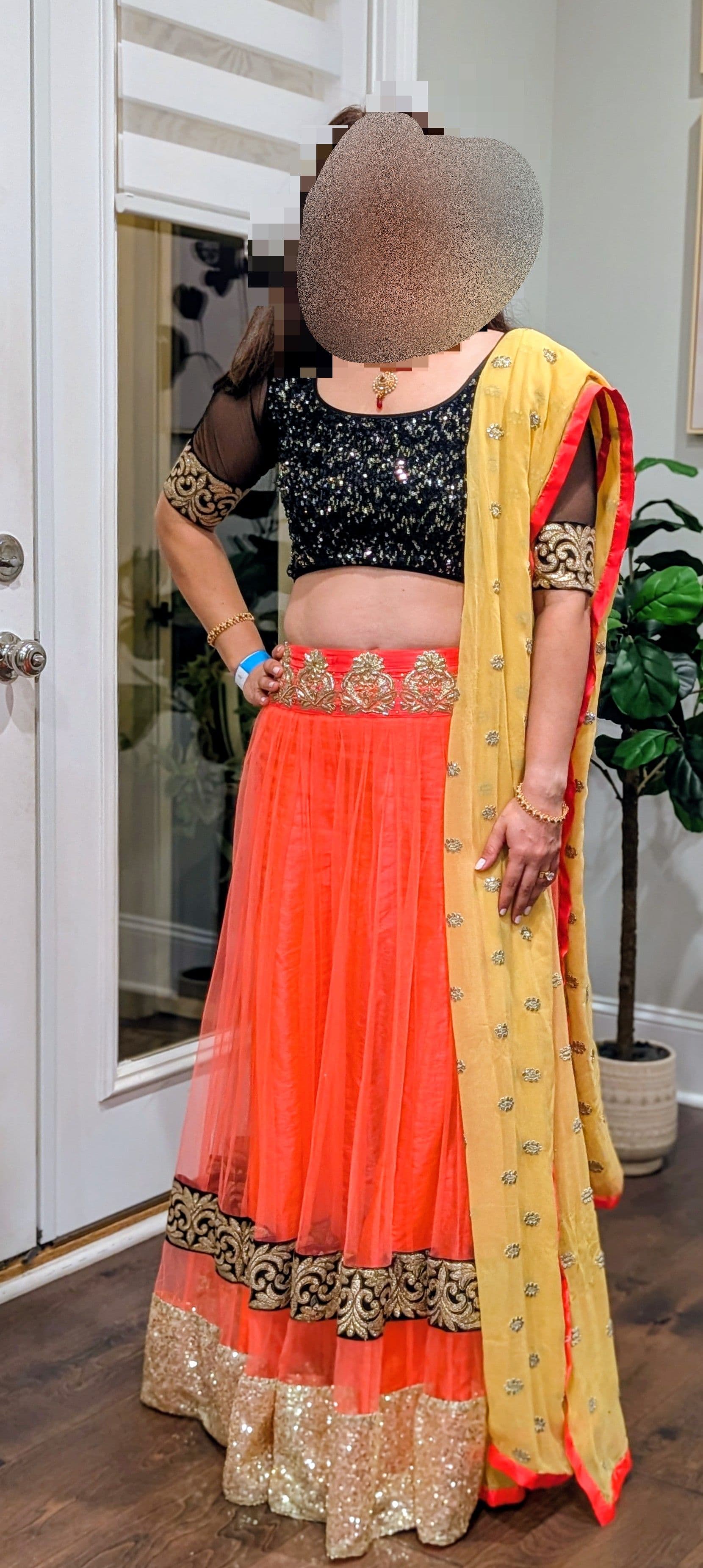 Vibrant Coral and Black Sequin Lehenga with Gold Embroidery and Yellow Dupatta