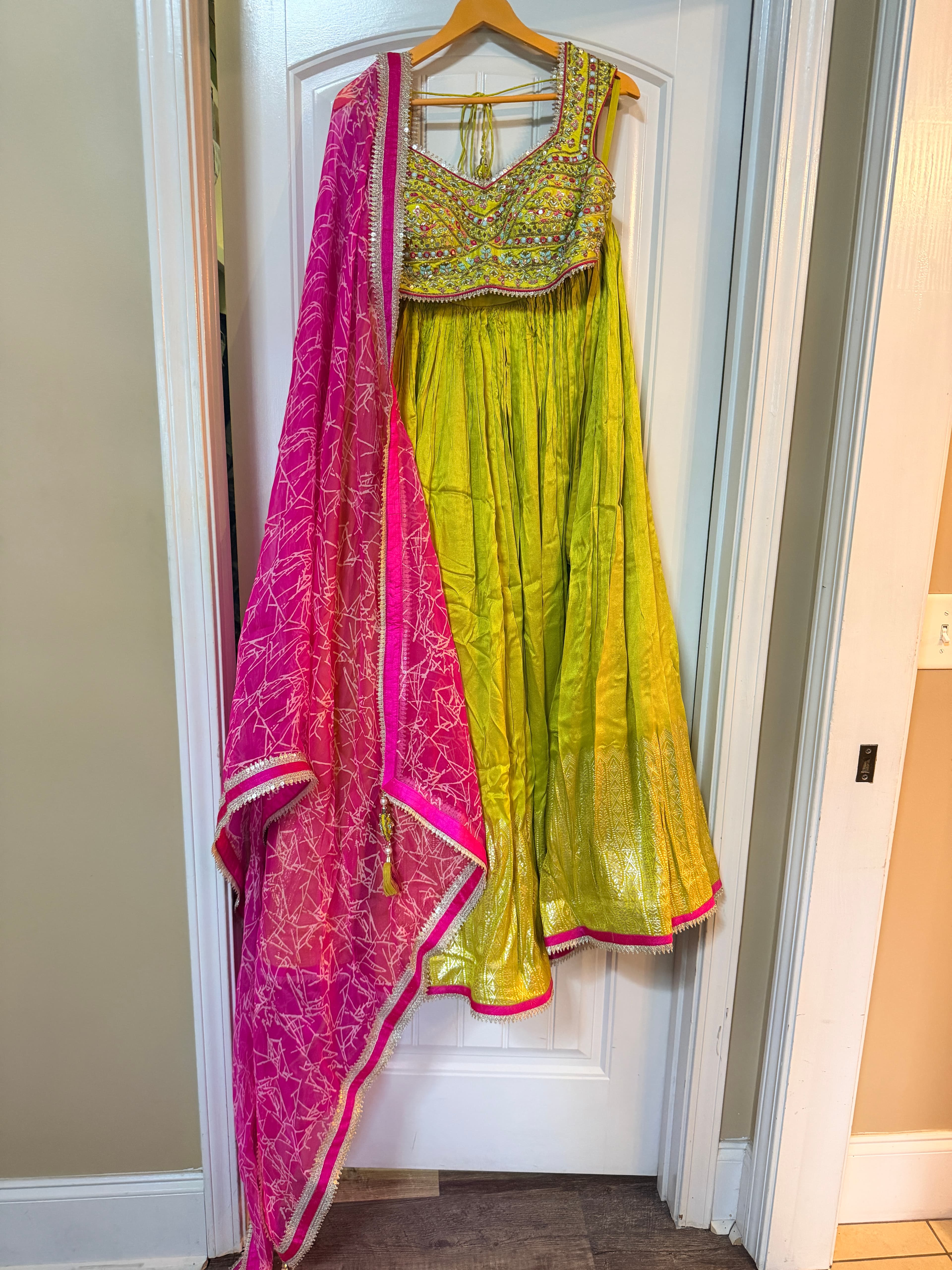 Vibrant Lime Green Lehenga with Pink Dupatta and Intricate Embroidery
