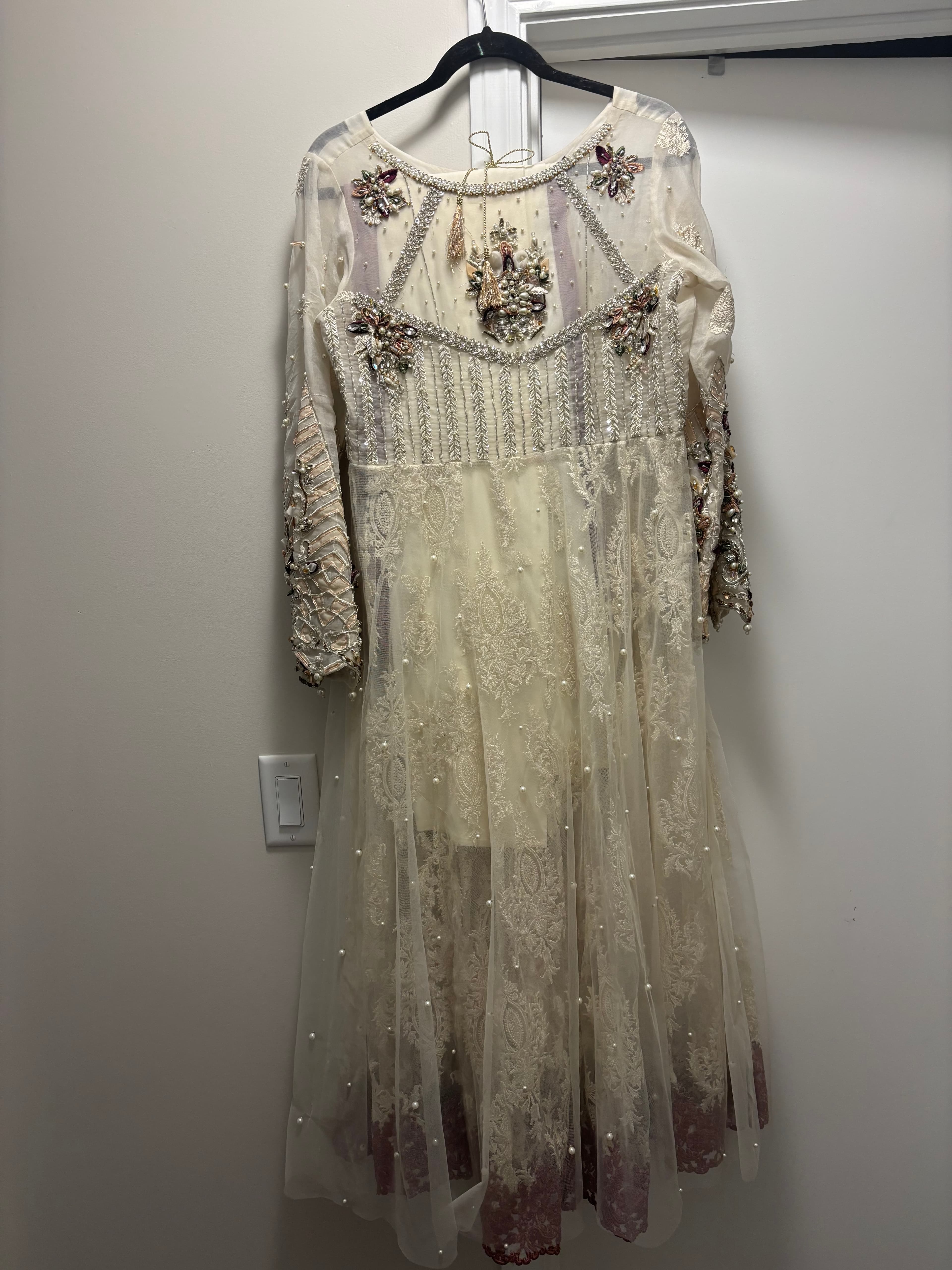 Elegant Ivory Net Anarkali Suit with Intricate Pearl and Stone Embellishments