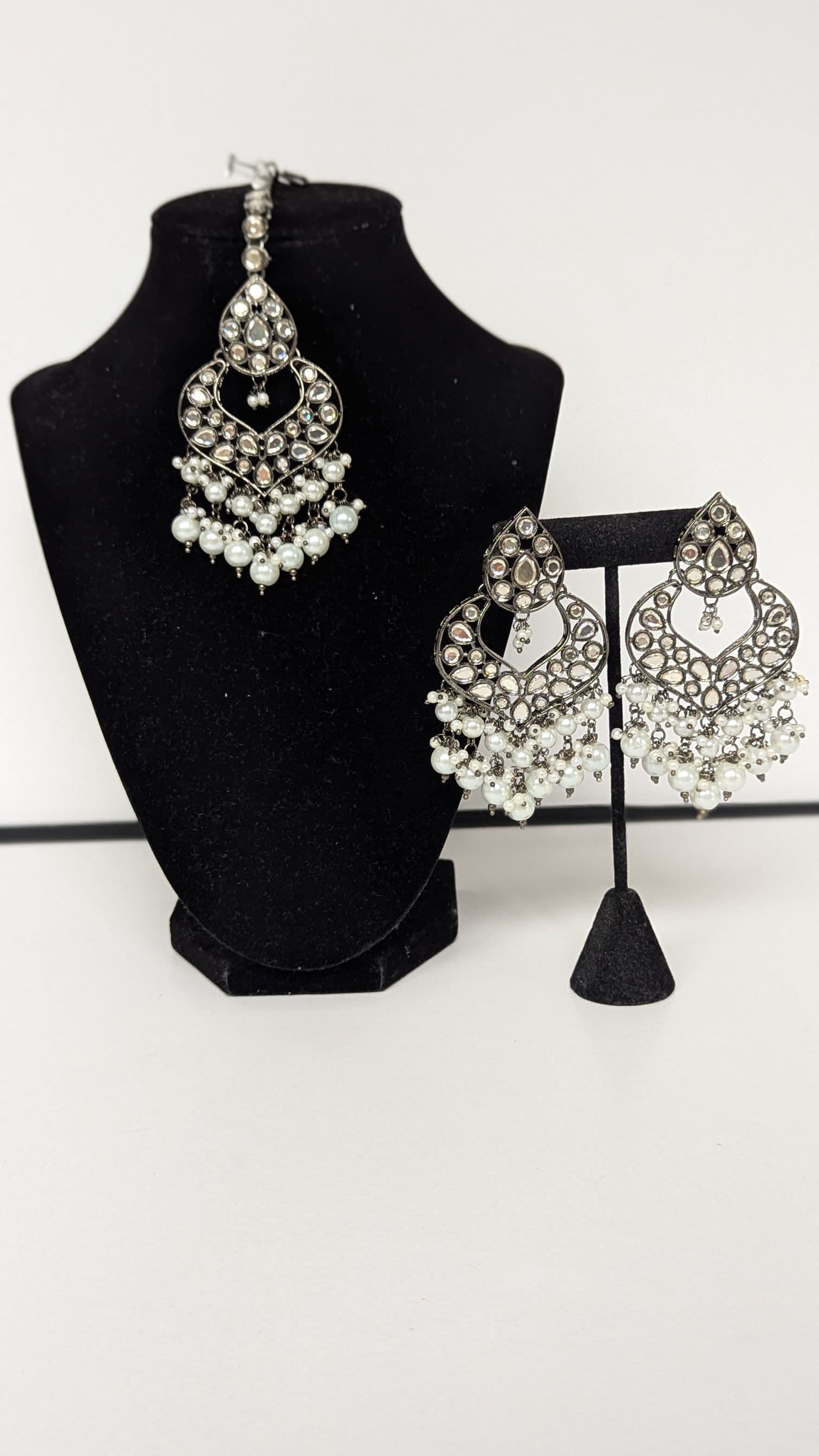 Elegant Silver Toned Kundan and Pearl Chandbali Earrings with Matching Maang Tika Set